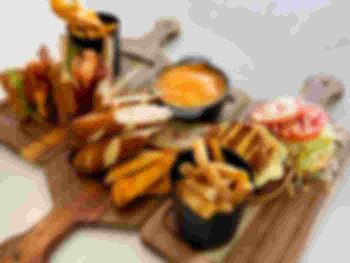 various appetizers on wooden cutting boards